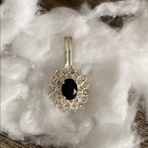 Silver and dark blue stone pendant